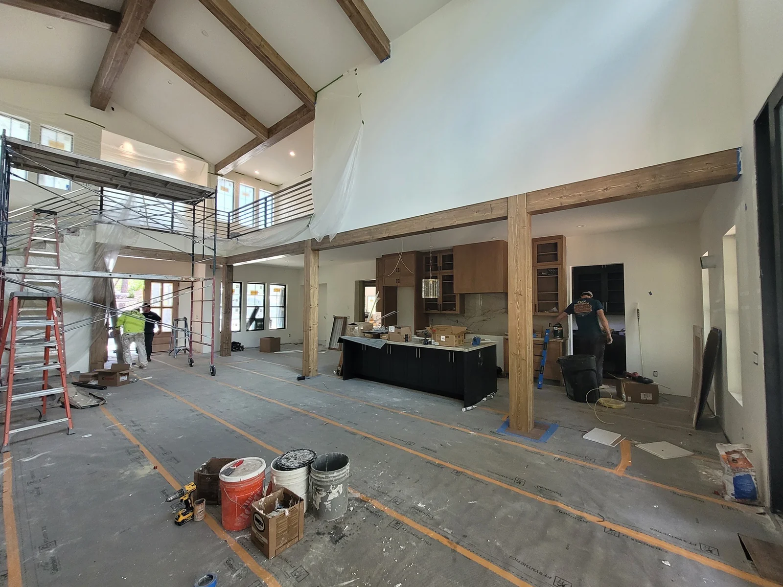 Custom hand-hewn mantle above a stone fireplace