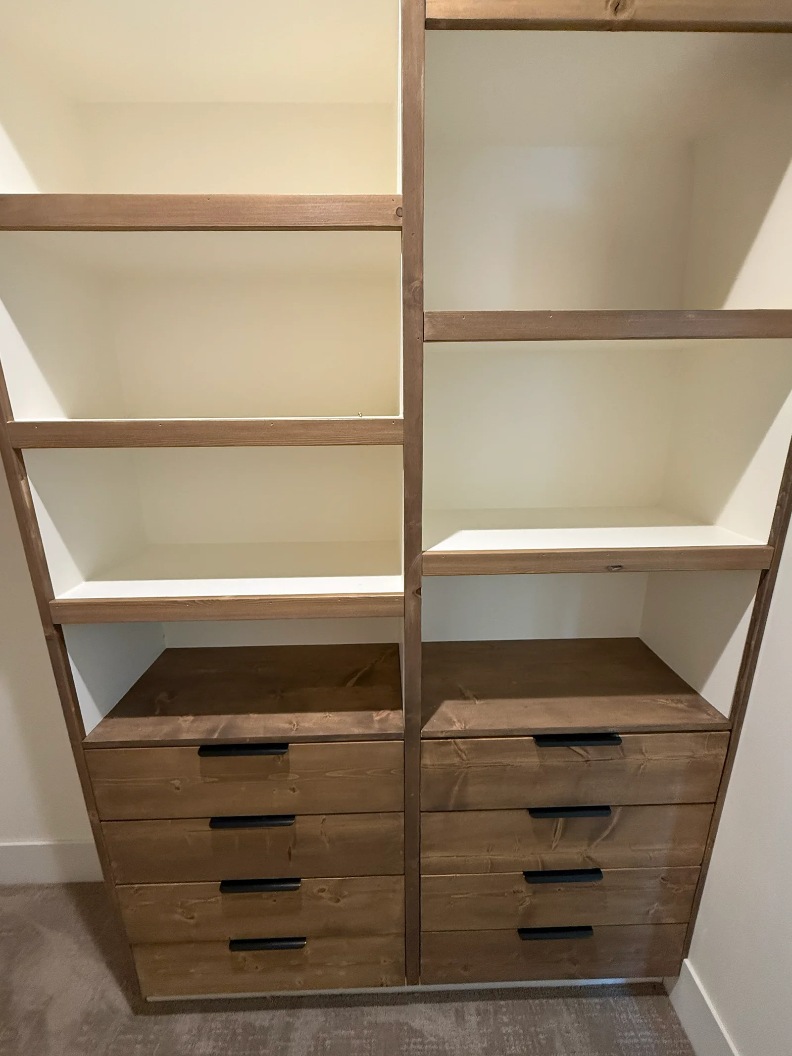 Custom walk-in closet build with drawers and hanging sections